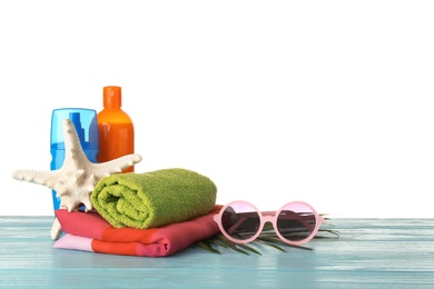 Photo of Set of different beach accessories on table against white background. Space for text