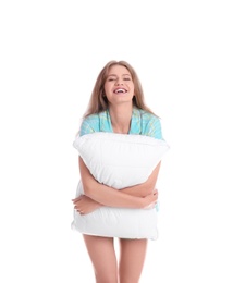 Photo of Young woman in pajamas embracing pillow on white background