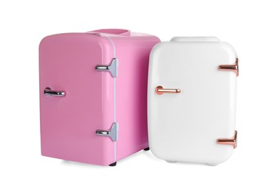 Photo of Mini refrigerators for cosmetics on white background