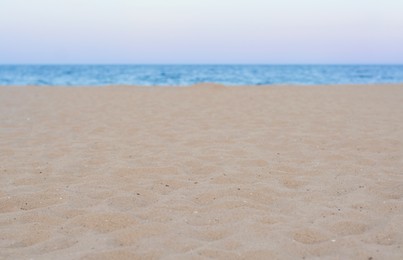 Photo of Sandy beach near beautiful sea, closeup view