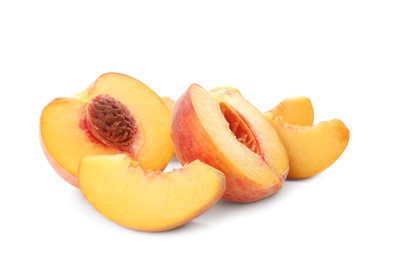 Photo of Cut fresh ripe peaches isolated on white
