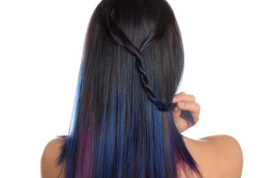 Photo of Young woman with bright dyed hair on white background, back view