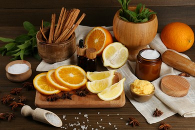 Photo of Homemade cosmetic products and fresh ingredients on wooden table