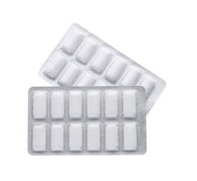Photo of Blisters with chewing gums on white background, top view