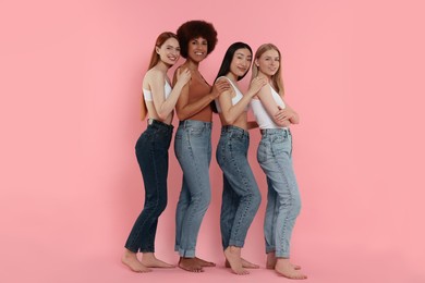 Photo of Portrait of beautiful young women on pink background