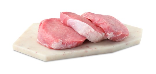 Photo of Board with pieces of raw pork meat isolated on white