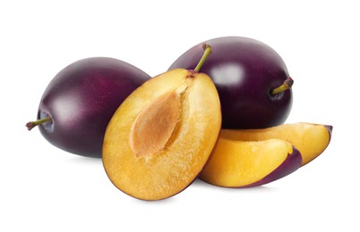Photo of Whole and cut ripe plums on white background