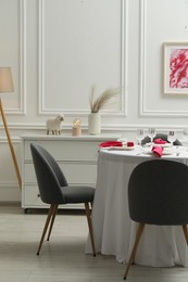 Photo of Color accent table setting and chairs in dining room