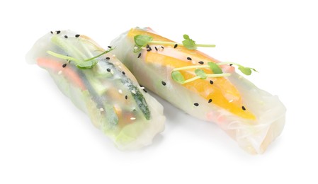 Photo of Tasty spring rolls with sesame seeds and microgreens isolated on white