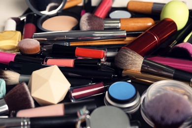Photo of Set of different makeup products and tools as background, closeup