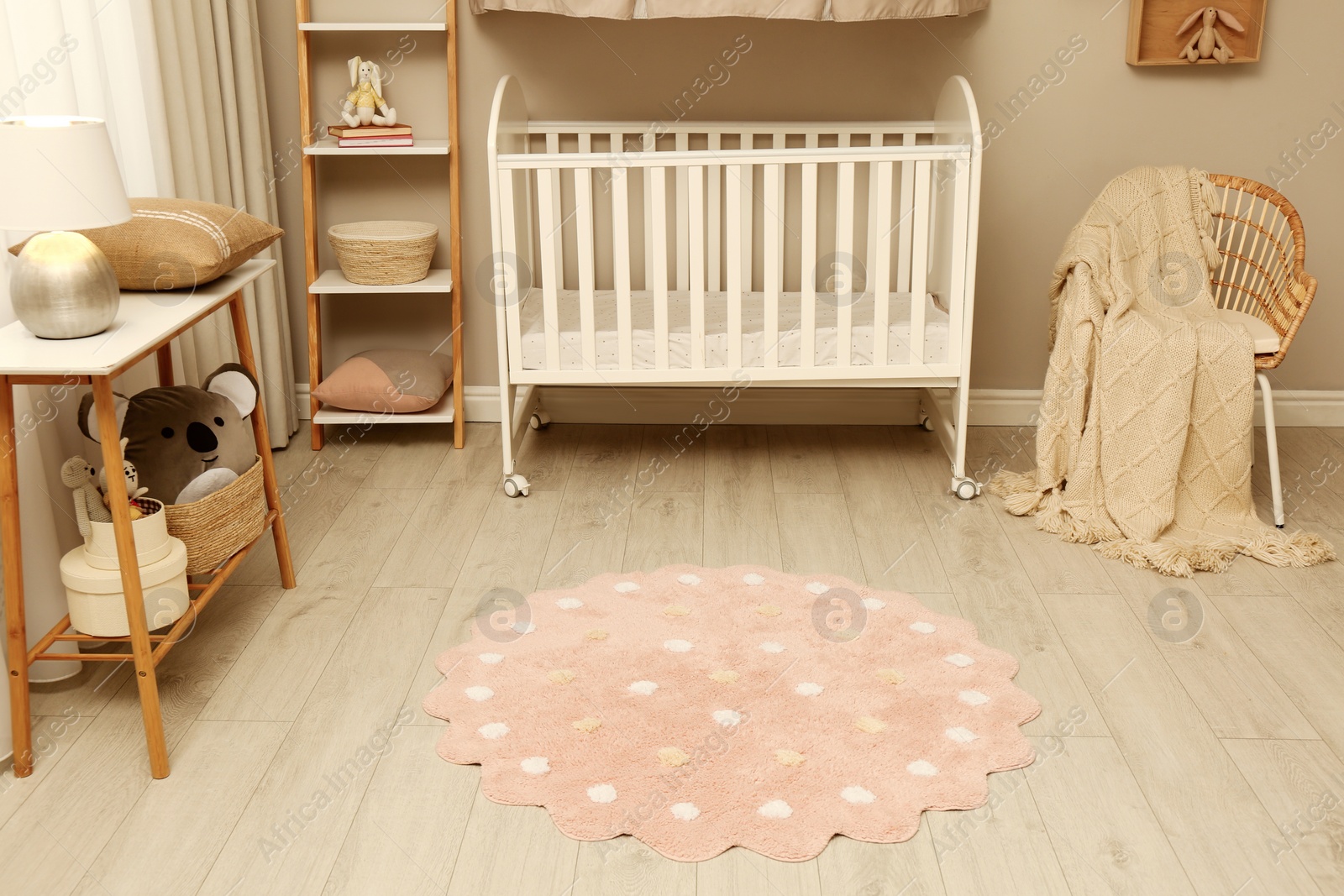 Photo of Baby room interior with modern furniture and soft rug