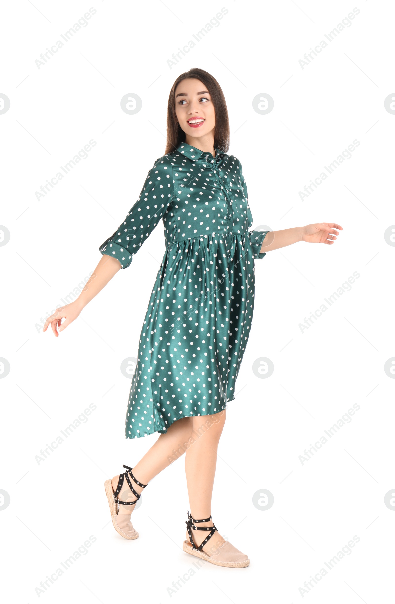 Photo of Portrait of beautiful young woman in stylish dress on white background