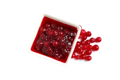 Photo of Cranberry sauce and fresh berries on white background, top view