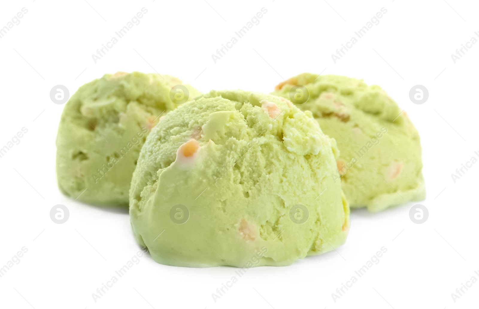 Photo of Scoops of delicious pistachio ice cream on white background