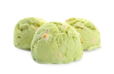 Photo of Scoops of delicious pistachio ice cream on white background