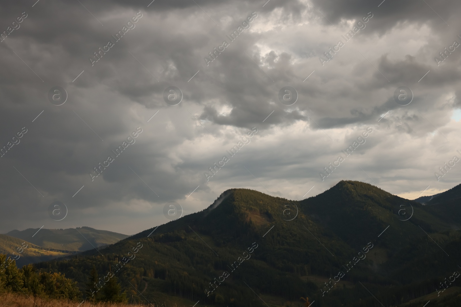 Photo of Picturesque view of cloudy sky over majestic mountain landscape