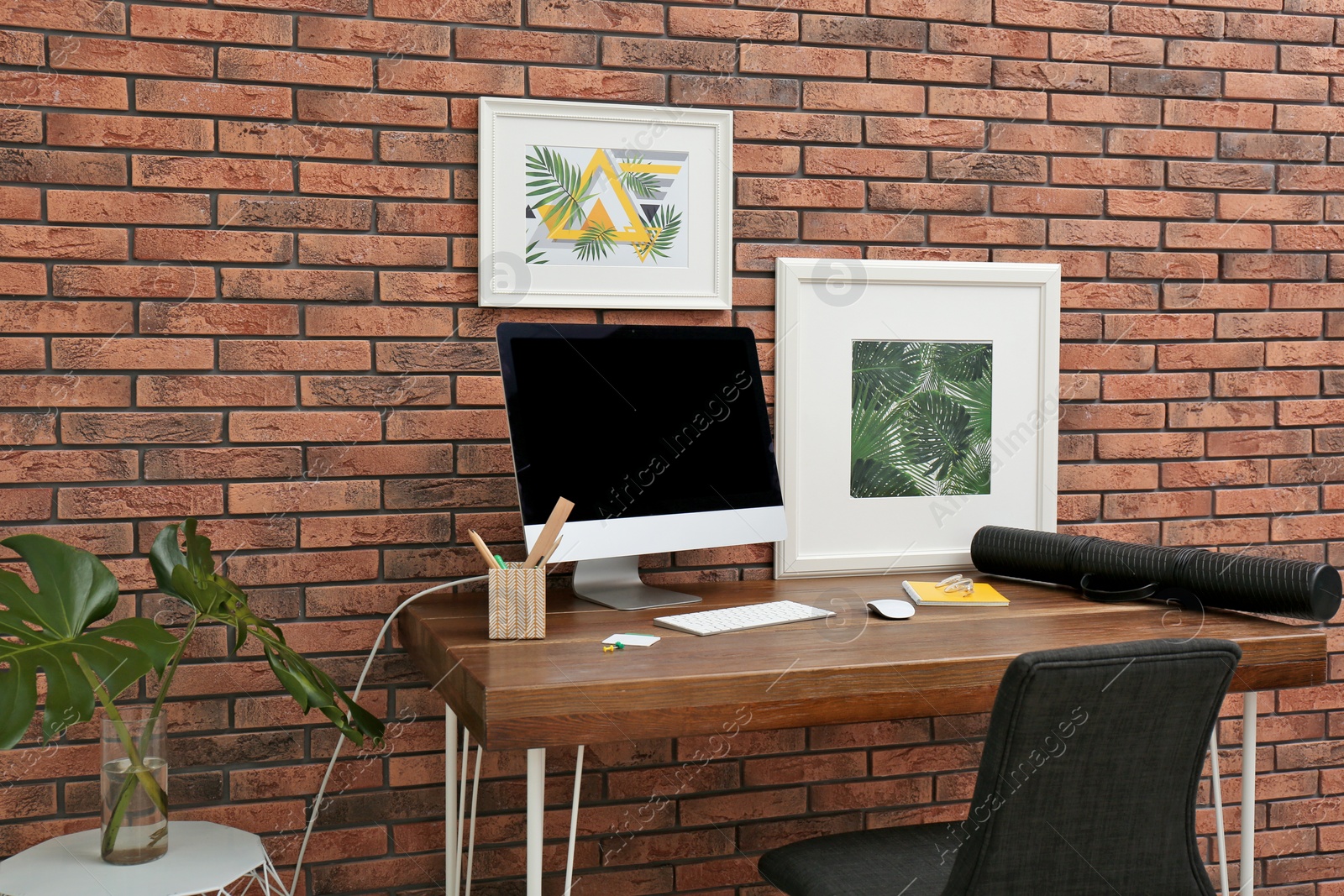 Photo of Interior of stylish workplace with modern computer at home