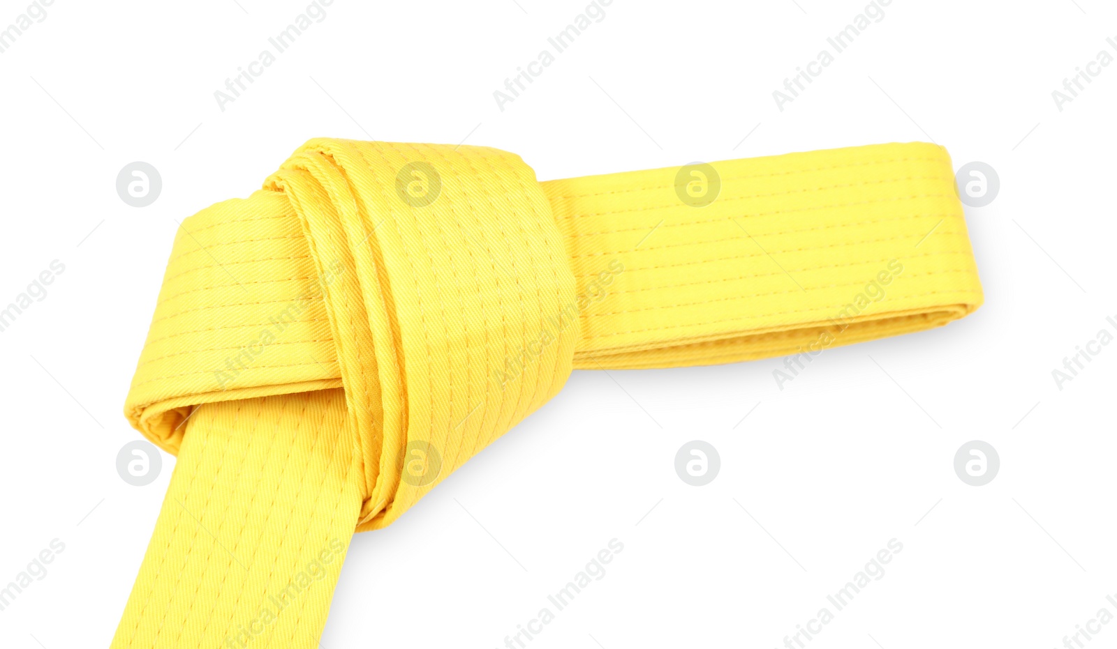 Photo of Yellow karate belt isolated on white. Martial arts uniform