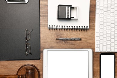 Photo of Flat lay composition with modern tablet on wooden table. Space for text