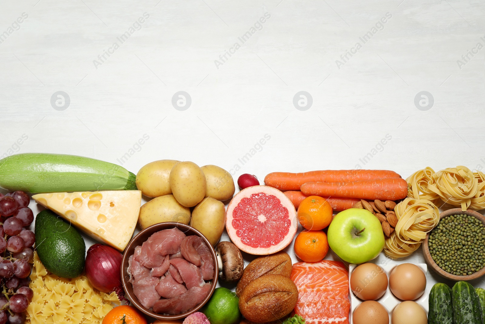 Photo of Different products on white table, top view. Healthy food and balanced diet