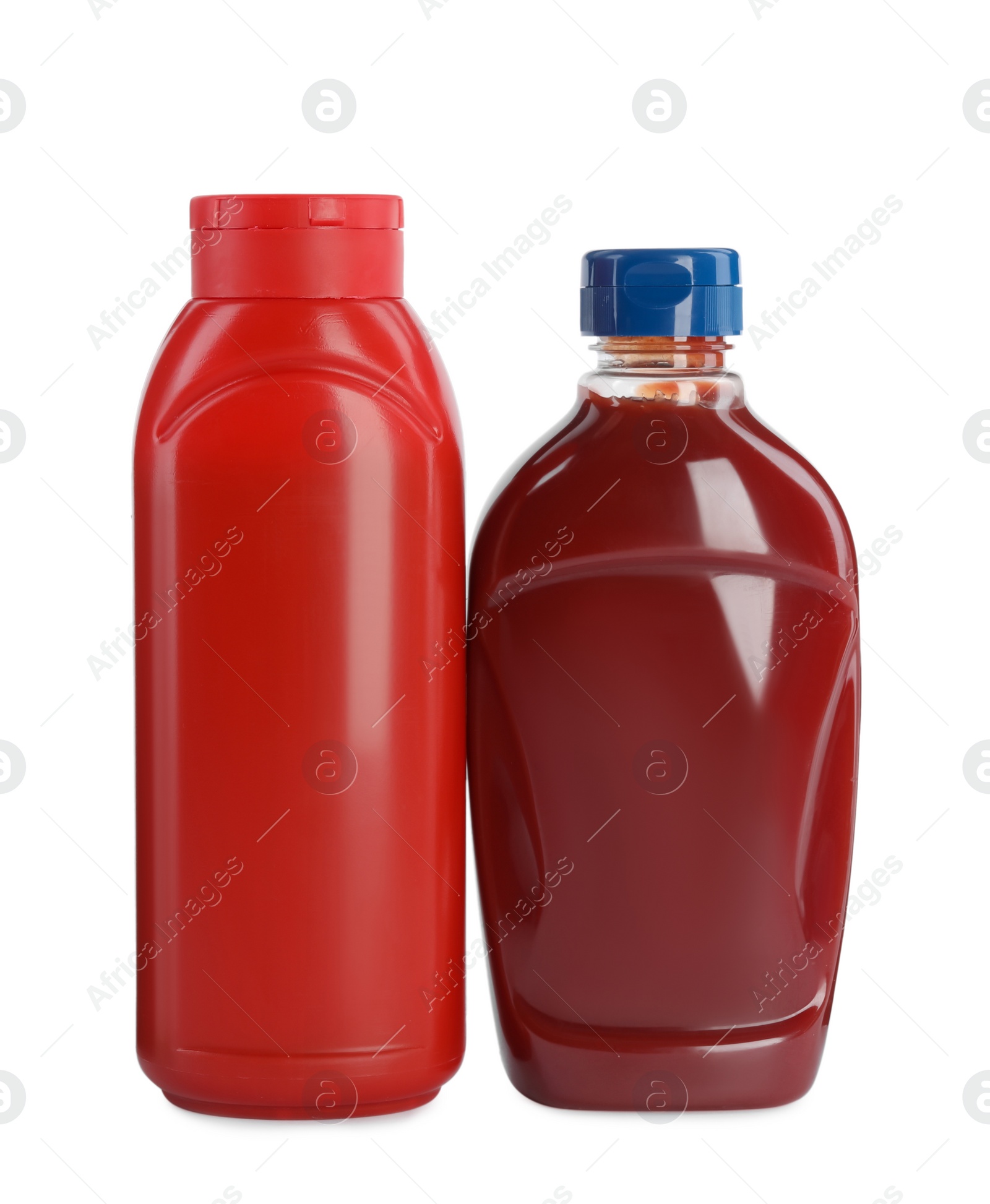 Photo of Different bottles of ketchup on white background