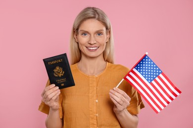 Photo of Immigration. Happy woman with passport and American flag on pink background
