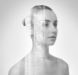 Image of Double exposure of woman and trees on grey background, black and white effect