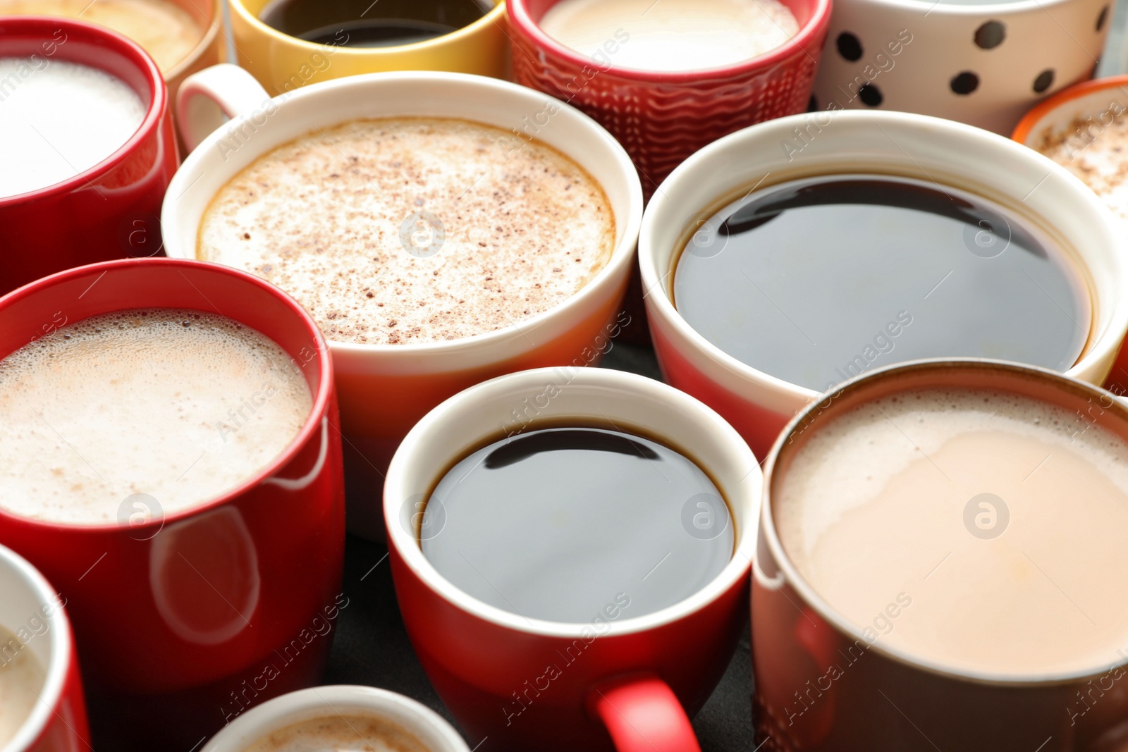 Photo of Many cups of different coffees on table, closeup