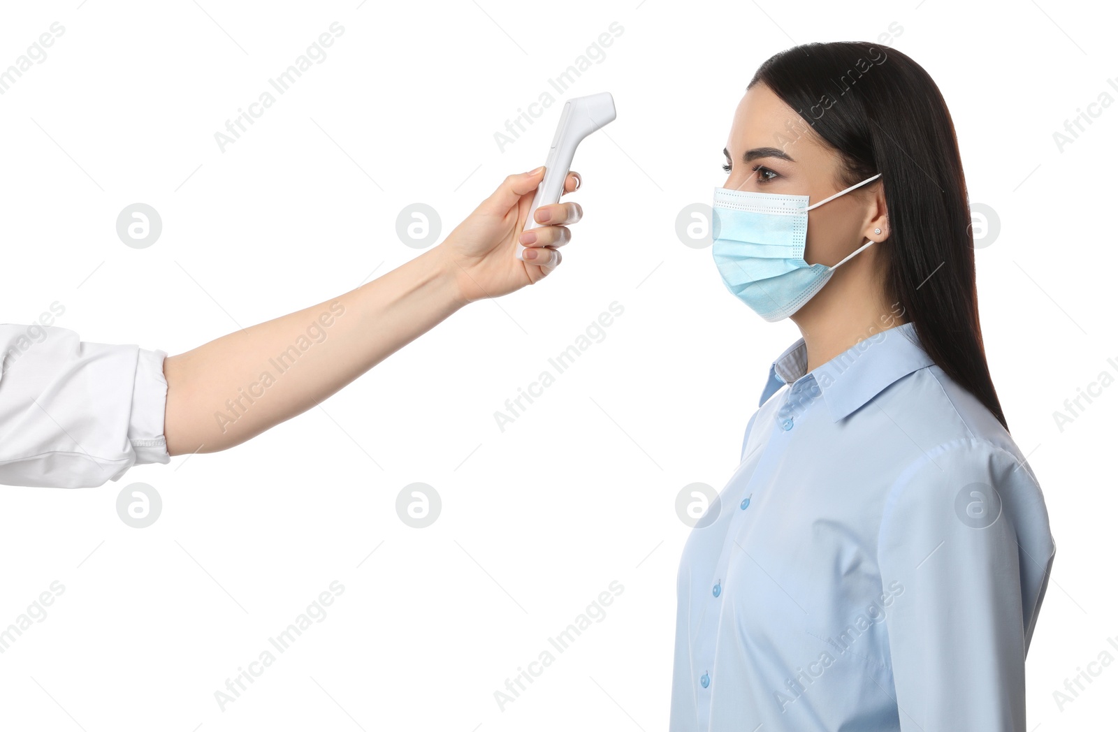 Photo of Doctor measuring woman's temperature on white background, closeup. Prevent spreading of Covid-19