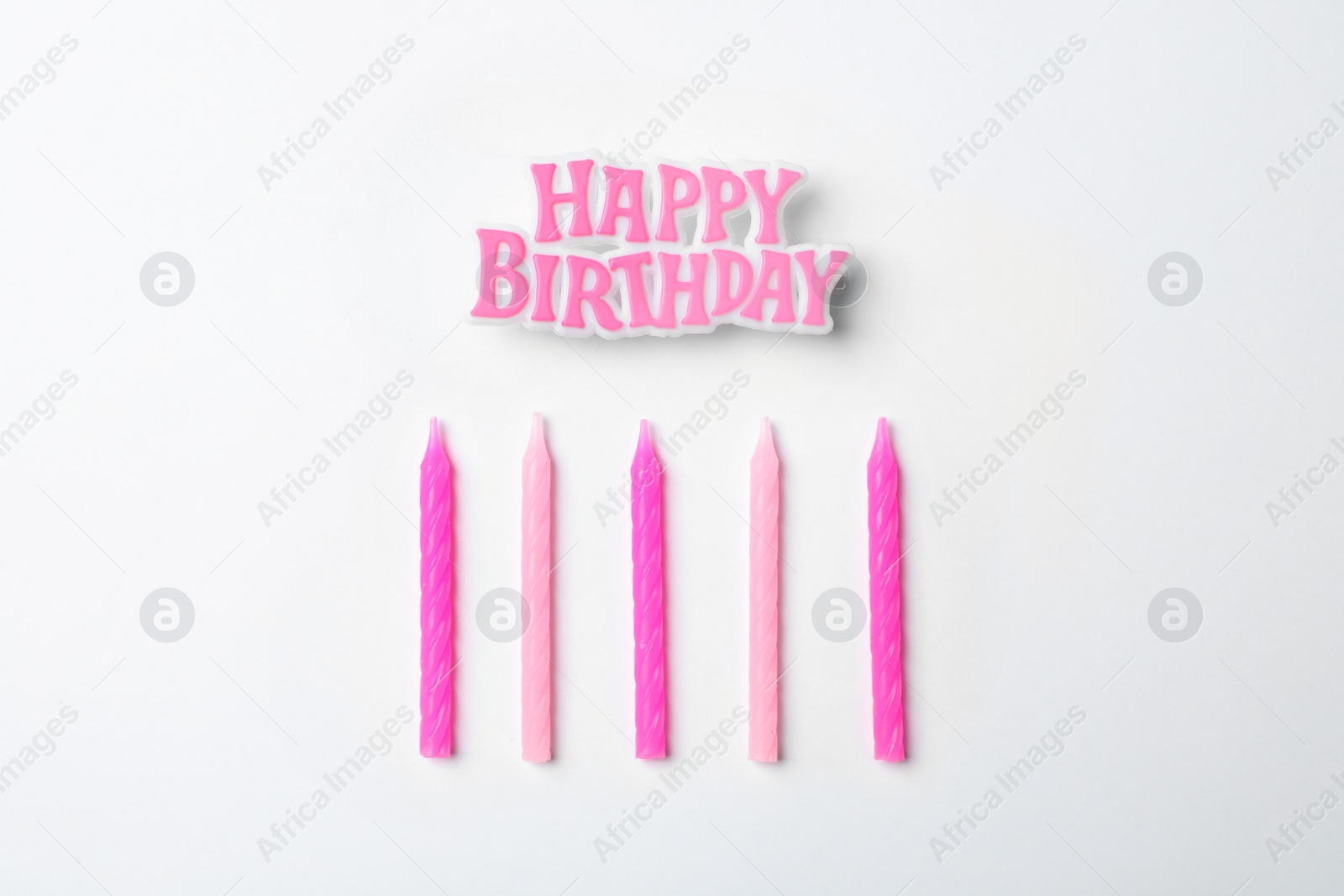 Photo of Flat lay composition with birthday candles on light background