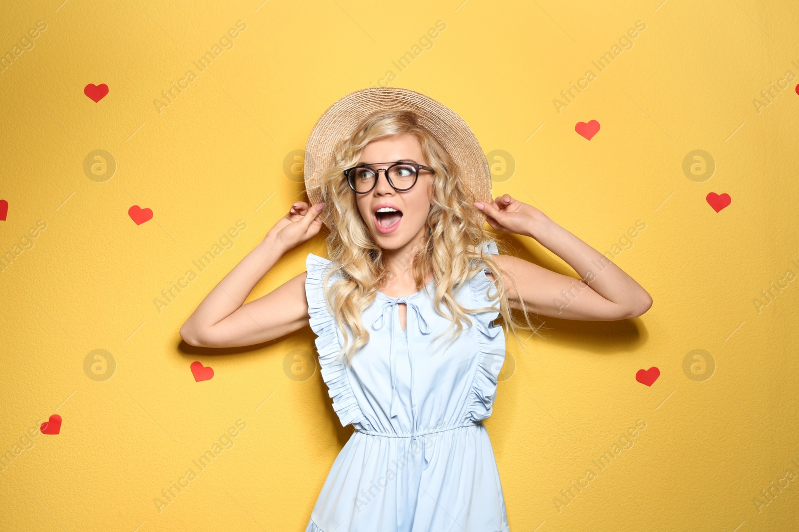 Photo of Emotional stylish young woman on color background