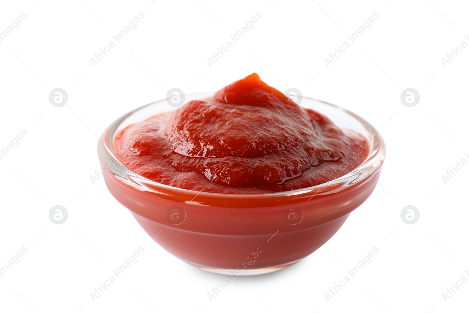 Photo of Tasty ketchup in glass bowl isolated on white, closeup