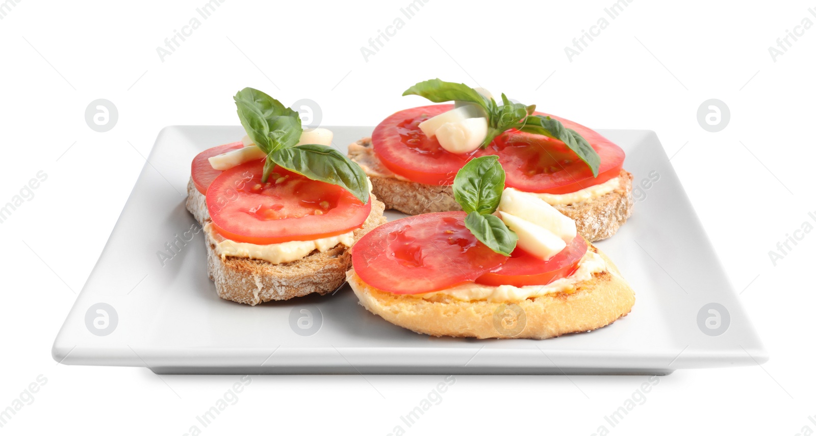 Photo of Tasty fresh tomato bruschettas on white background