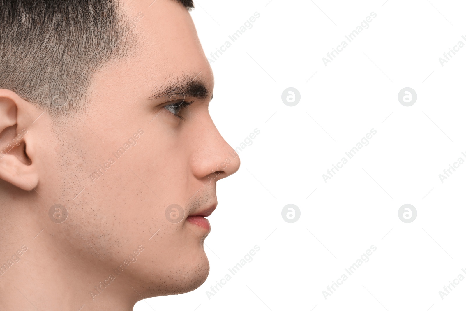 Photo of Portrait of young man on white background, closeup