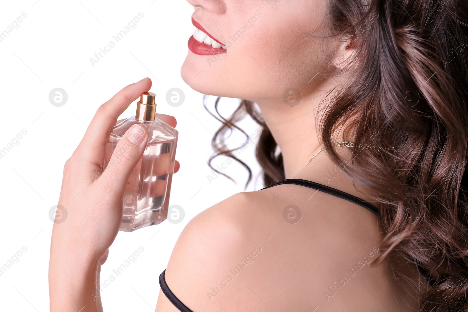 Photo of Beautiful young woman with bottle of perfume on white background, closeup