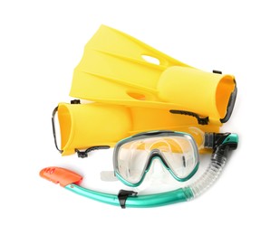 Pair of yellow flippers and mask on white background, top view