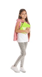 Photo of Pretty preteen girl with notebooks against white background