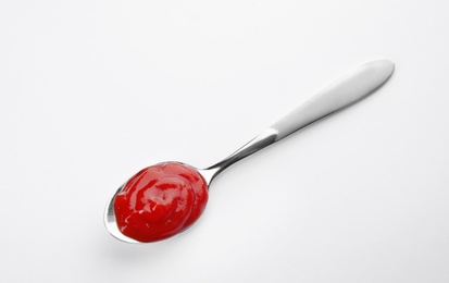 Photo of Tasty homemade tomato sauce in spoon on white background, top view