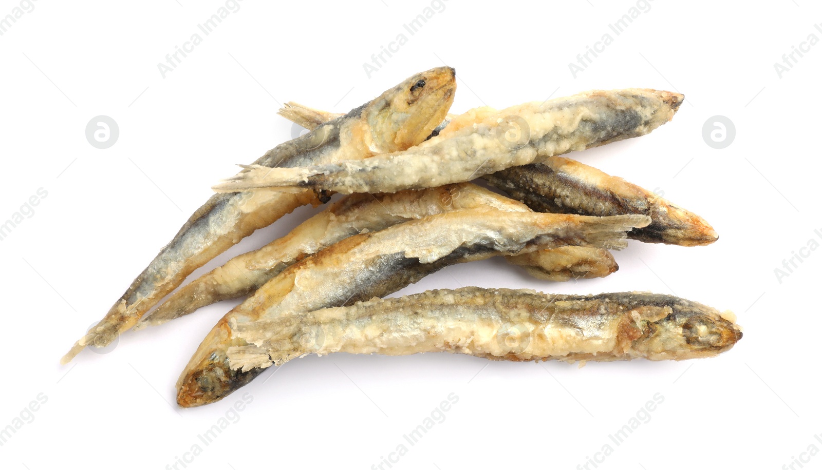 Photo of Pile of delicious fried anchovies on white background, top view