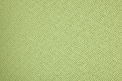 Stylish green wallpaper as background, closeup view