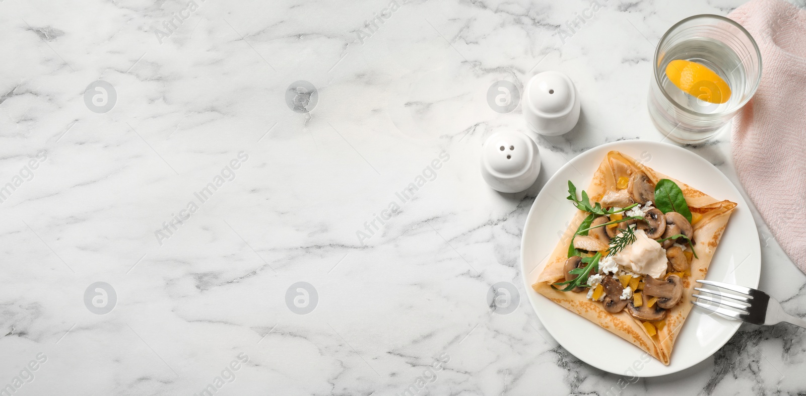 Image of Delicious breakfast with thin pancake on marble table, flat lay. Banner design, space for text
