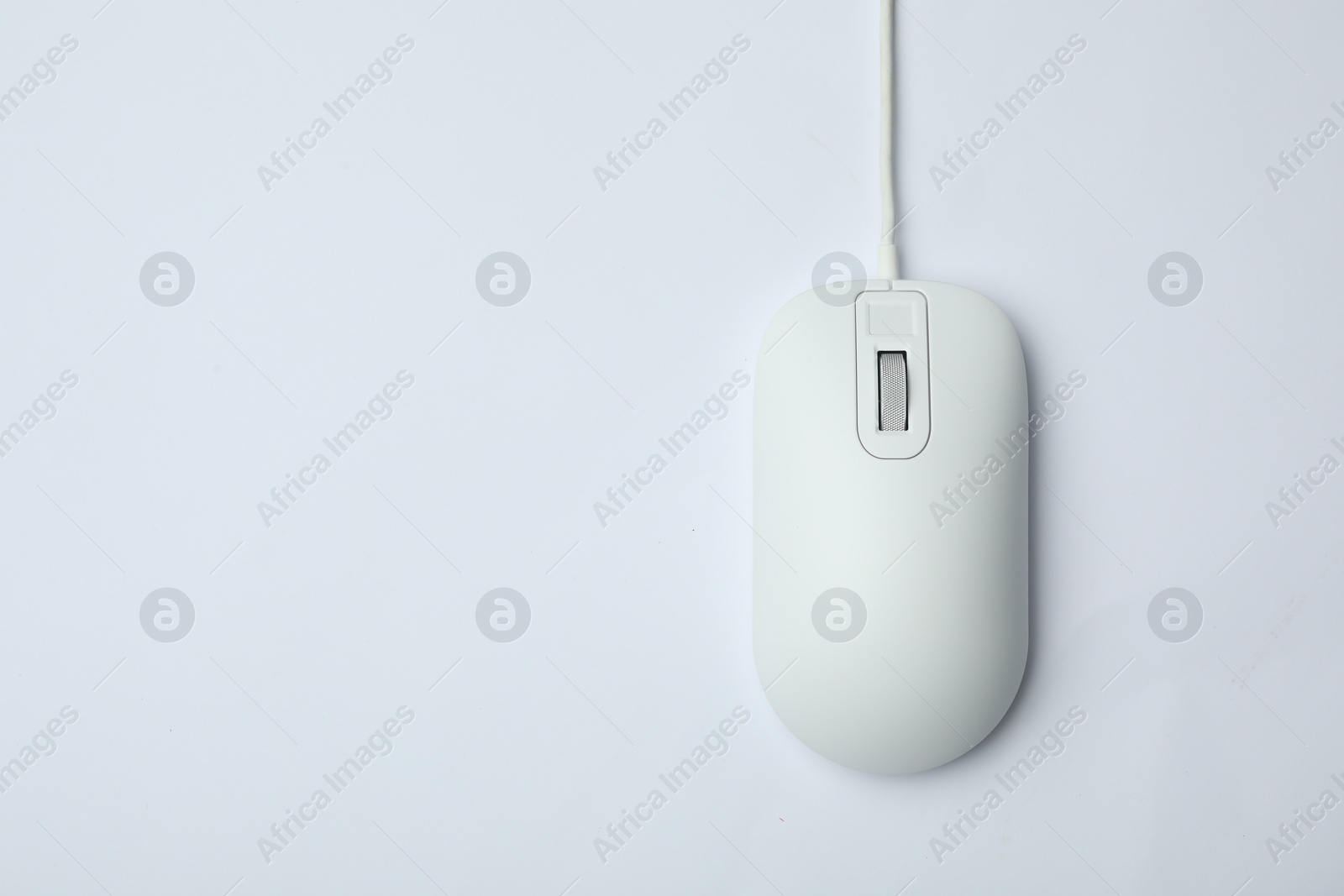 Photo of Wired computer mouse isolated on white, top view