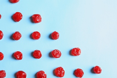 Flat lay composition of cherries on color background, space for text. Dried fruit as healthy snack