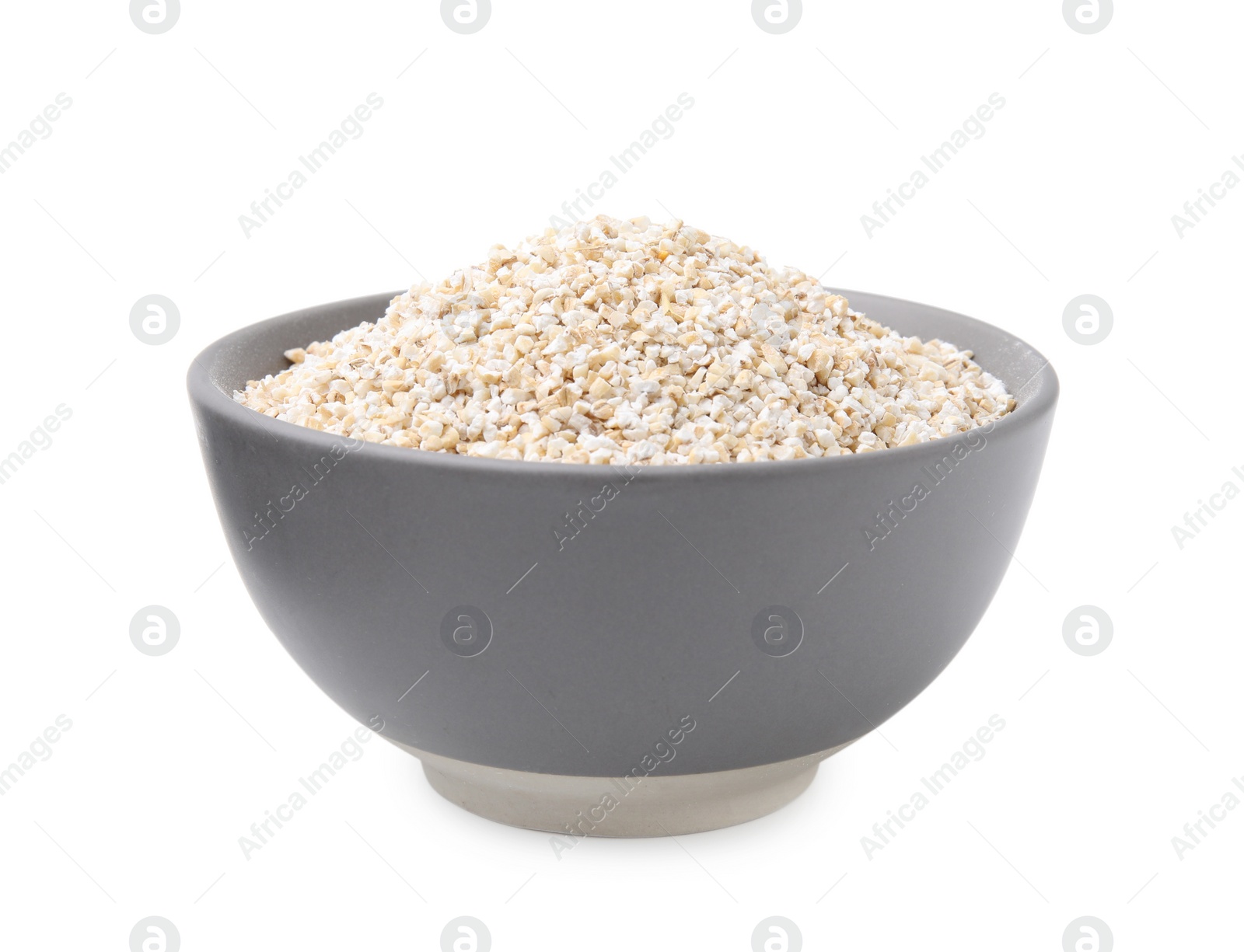 Photo of Dry barley groats in bowl isolated on white