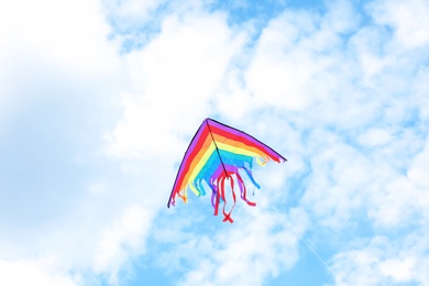 Photo of Beautiful kite drifting in blue sky