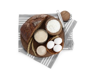 Photo of Freshly baked bread, sourdough, flour, eggs and spikes on white background, top view