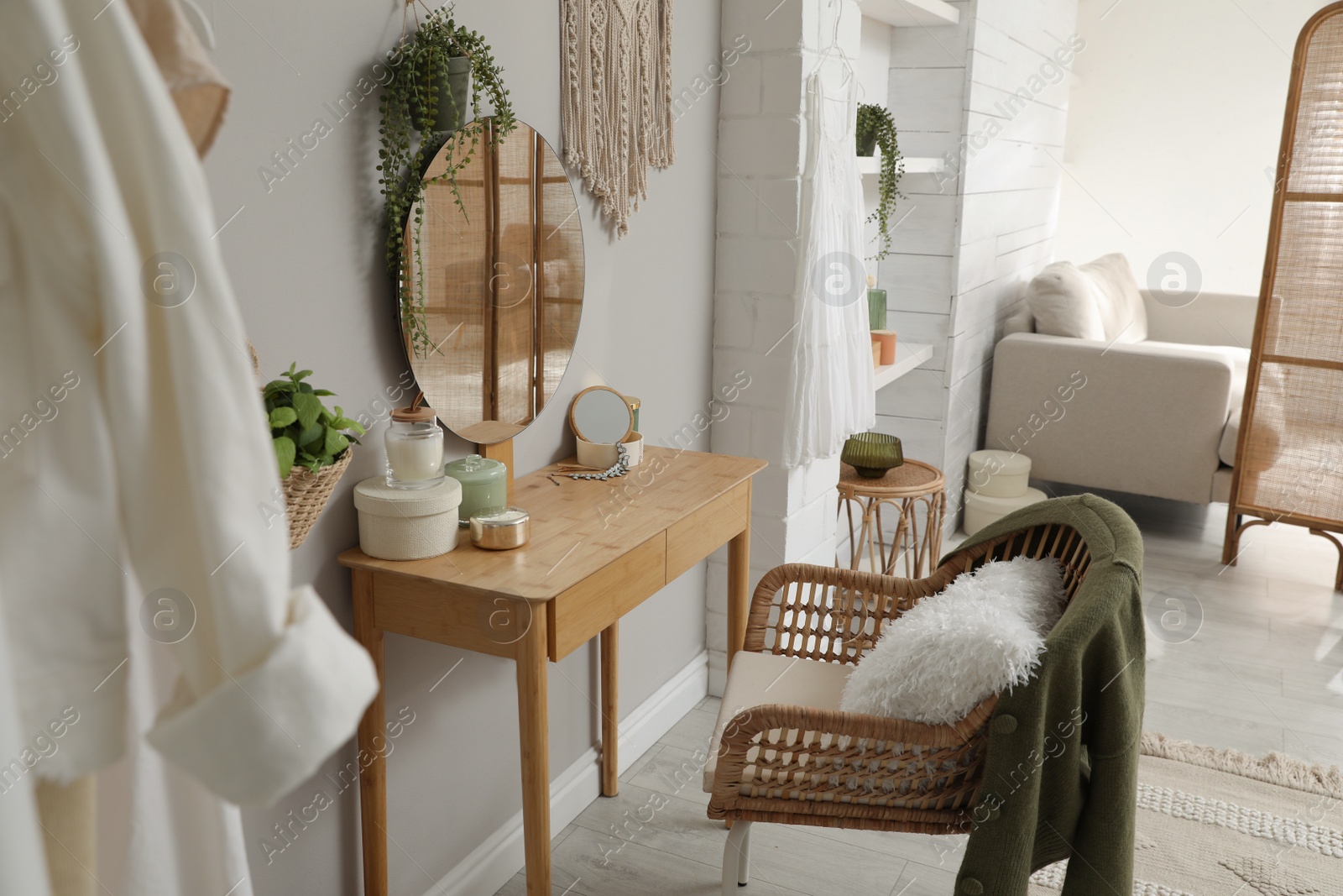 Photo of Wooden dressing table with decorative elements in room. Interior design