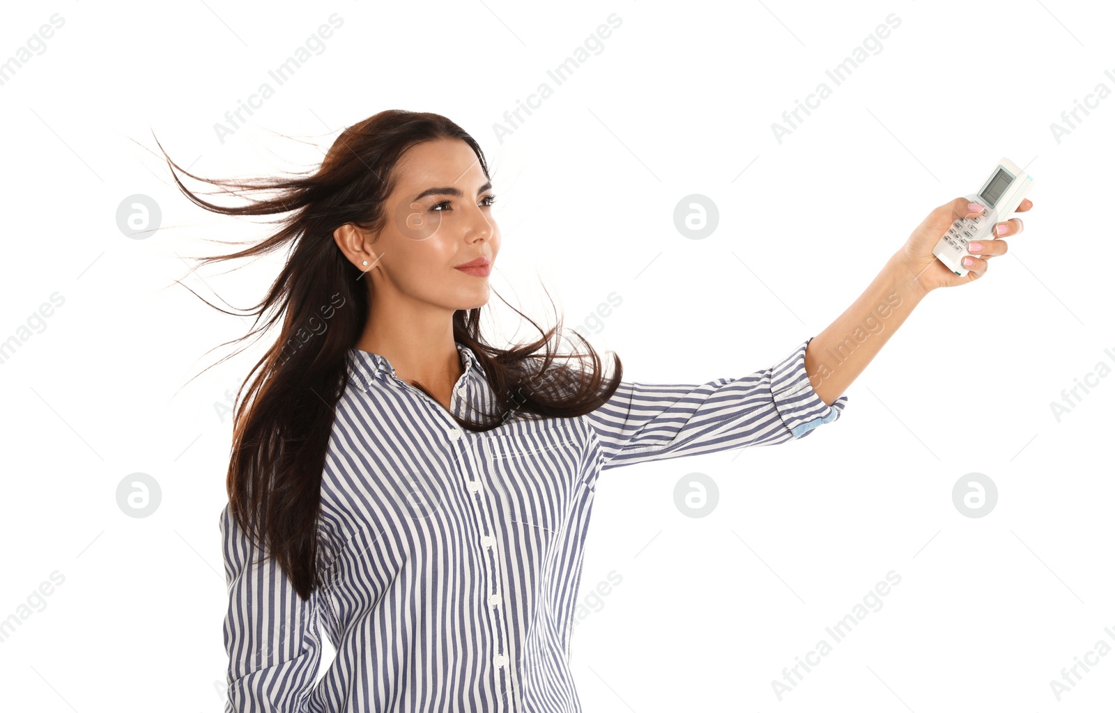 Photo of Young woman turning on air conditioner against white background