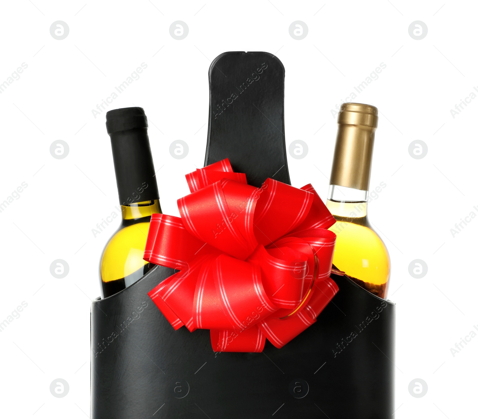 Photo of Wine bottles in festive package with red bow isolated on white