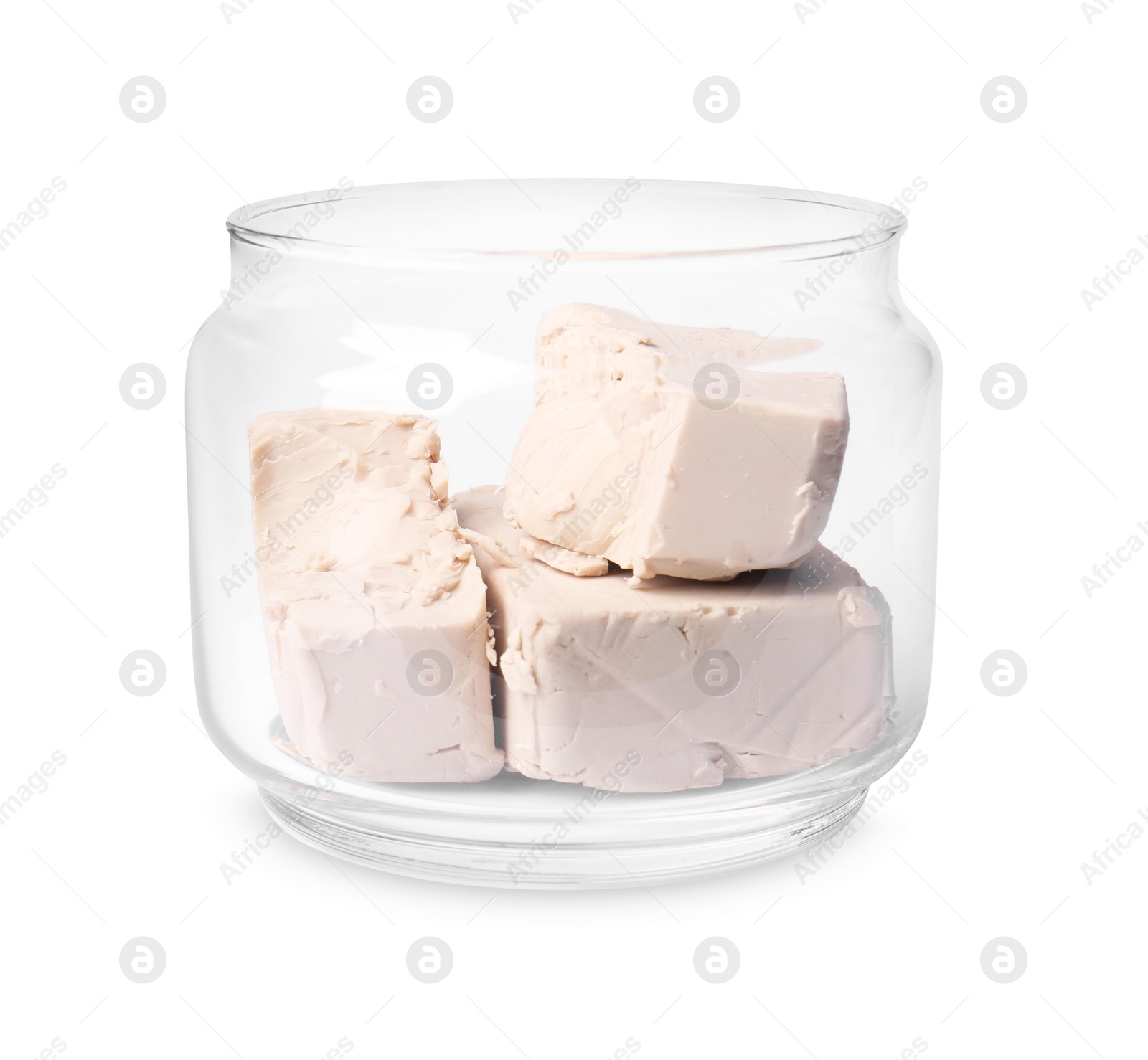 Photo of Pieces of compressed yeast in glass jar isolated on white